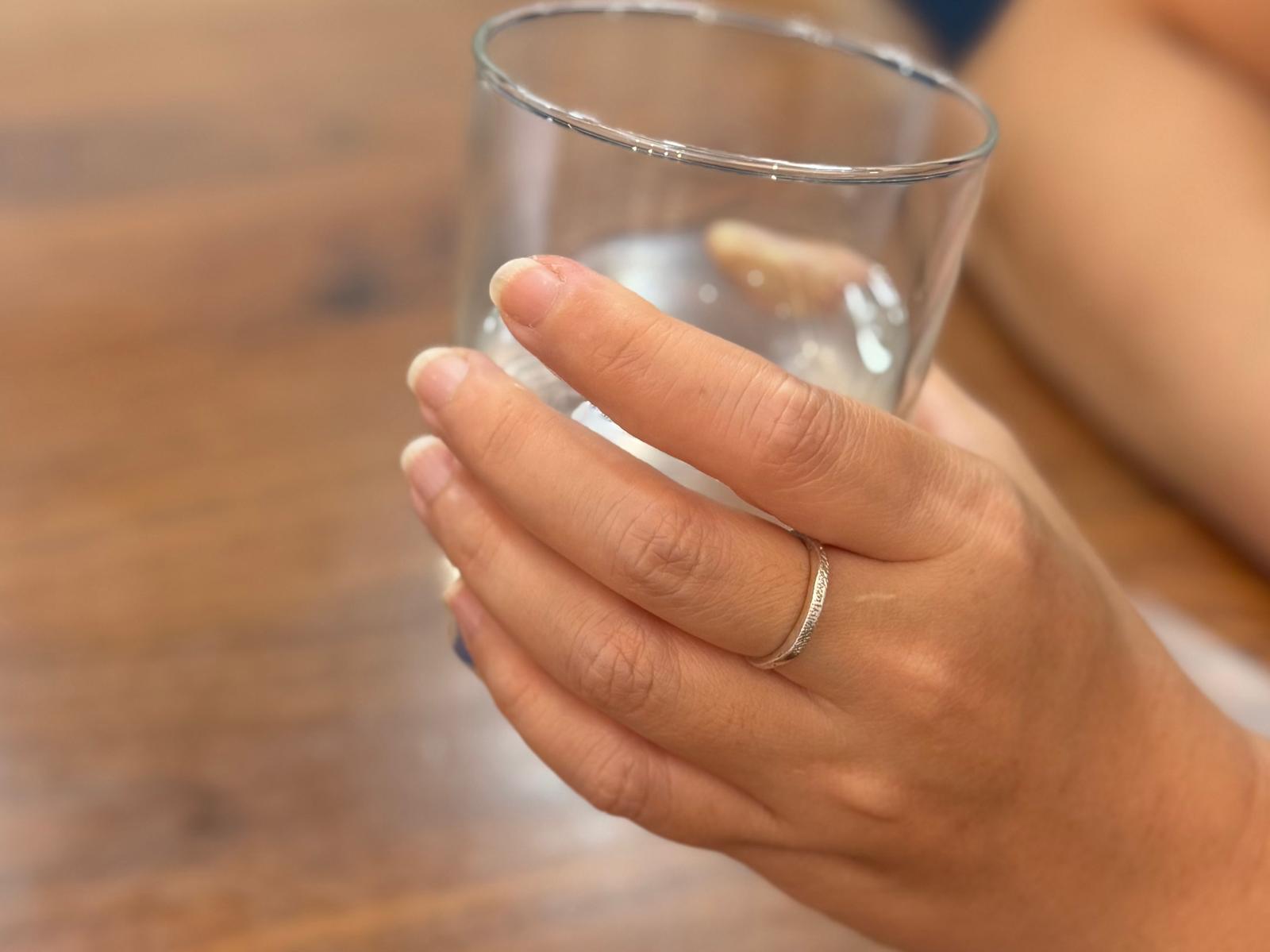 925 sterling ring with subtle nose texture worn on a hand