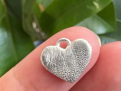Real nose-print pendant with visible 3D texture